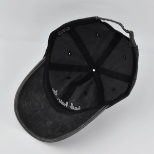 Detail of 100% cotton baseball cap interior featuring metal buckle and reinforced stitching