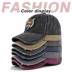 Multiple colors of distressed cotton baseball caps with tiger head embroidery