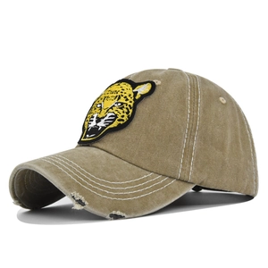 Detail view of khaki vintage washed cotton baseball cap with leopard embroidery