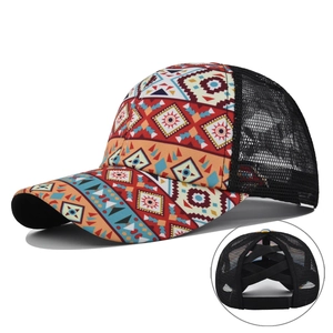 Detail of bohemian baseball cap featuring a mesh back and elastic criss-cross ponytail hole