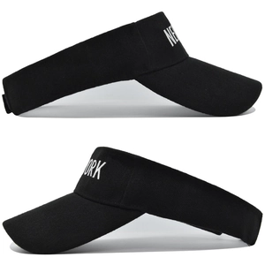 Detail of white NEW YORK embroidery on black canvas sun visor with velcro closure