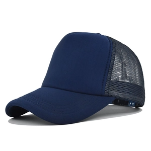 Detailed close-up of breathable mesh panel and reinforced stitching on blue trucker hat