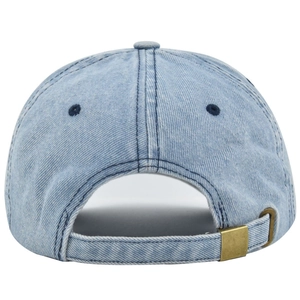 Detail view of denim baseball cap with adjustable strap and brass metal buckle