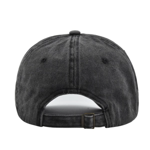 Detail view of washed cotton baseball cap with vintage metal buckle and adjustable strap