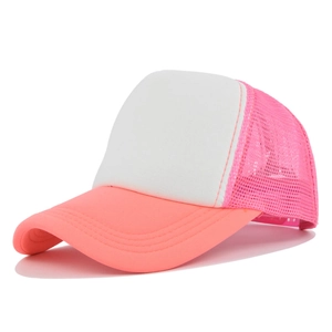 Detail view of pink mesh and white foam panels on a classic breathable trucker hat