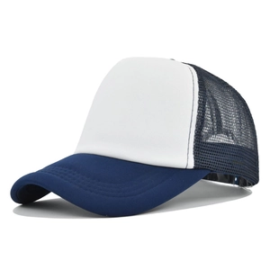 Detail of blue and white trucker hat featuring breathable mesh and reinforced curved brim