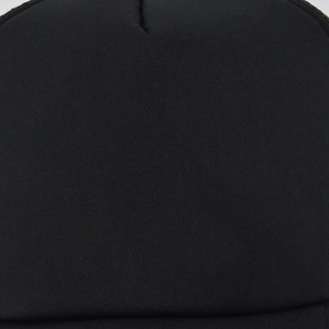 Macro texture of black mesh fabric on baseball cap crown showing breathable knit detail