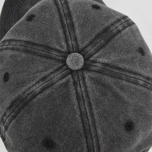 Top view of washed cotton baseball cap showing six-panel crown and embroidered eyelets