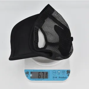 Close-up of lightweight black mesh baseball cap weighing only 67.1 grams on a scale