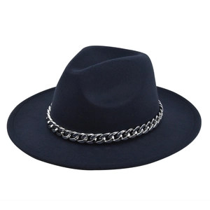 Detail of navy wool fedora hat featuring a chunky silver metal chain around the crown
