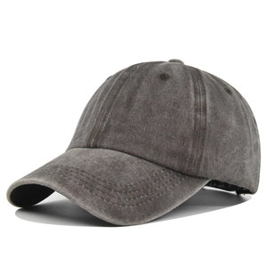 Macro detail of charcoal grey washed cotton twill baseball cap with vintage finish
