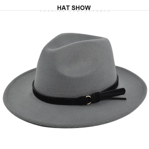 Detail of grey wool fedora hat featuring a black leather band and gold metal buckle