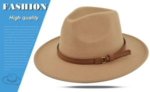 Close-up of camel wool fedora hat with a dark brown suede band and golden metal buckle