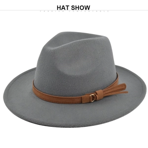 Close-up of a grey felt fedora with a brown suede belt and gold metal buckle detail