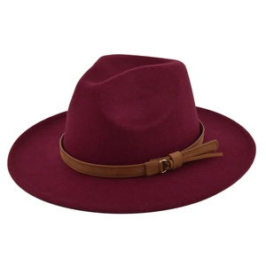 Detail of burgundy wool fedora with brown leather band and golden metal buckle