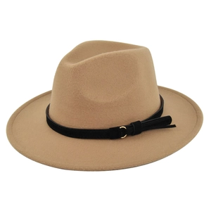 Detail of camel wool fedora hat featuring a black faux suede band and gold metal buckle