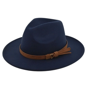 Close-up of a navy wool fedora hat featuring a brown leather band and gold metal hardware