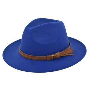 Macro detail of royal blue wool fedora with dark brown leather belt and gold buckle