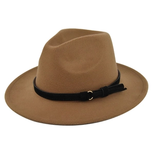 Close-up of brown wool fedora hat featuring a black faux leather band with gold ring detail