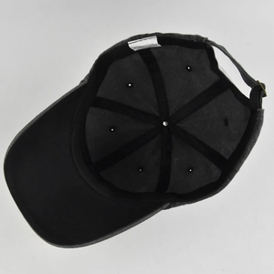 Detailed interior of vintage cotton baseball cap showing stitching and label
