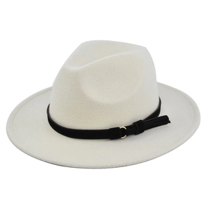 Close-up of beige fedora hat featuring a black faux suede band and gold metal ring detail
