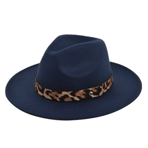 Detail of navy wool fedora hat featuring leopard print band and gold metal buckle