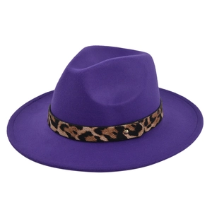 Detail view of purple wool fedora hat featuring a leopard print belt and gold metal stud