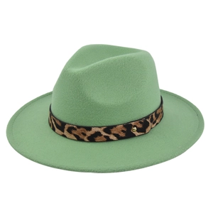 Close-up of mint green wool fedora hat featuring a leopard print belt and gold metal buckle