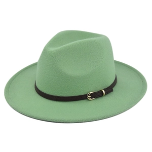 Detailed close-up of a mint green wool fedora with a brown leather belt and gold buckle
