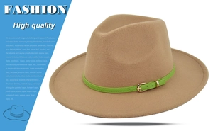 Detail of khaki wool fedora hat featuring a green faux leather band and gold buckle