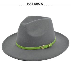 Detailed close-up of a grey fedora hat featuring a green leather band and golden buckle