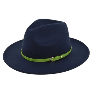 Detail of navy wool fedora with vibrant green leather band and metallic buckle buckle close-up