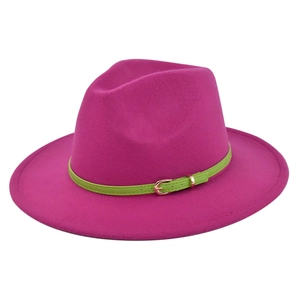 Close-up of rose red wool fedora hat with neon green belt and golden metal buckle detail