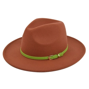 Detailed macro view of the caramel felt fedora with a vibrant neon green leather strap buckle