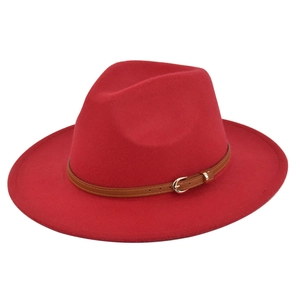 Detail of red wool felt fedora featuring a slim brown faux leather belt with metal buckle