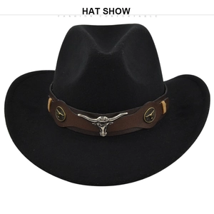 Close-up of black wool felt cowboy hat featuring a silver bull skull on a brown belt