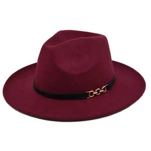 Detail of burgundy wool felt jazz hat with a black band and gold chain buckle accent