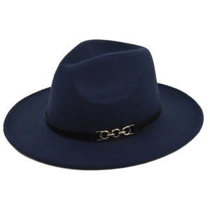 Detail of navy blue wool fedora hat featuring a black band with gold metal chain link