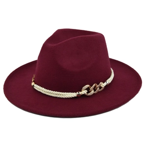Close-up of deep burgundy fedora hat featuring white braided rope and gold rhinestone trim