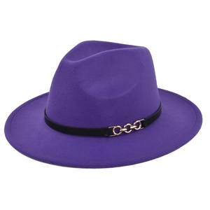 Close-up of deep purple wool fedora hat featuring a black leather band and gold chain buckle