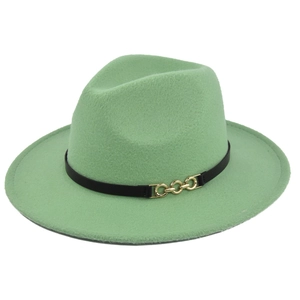 Detailed shot of mint green fedora hat with a black leather band and gold chain buckle