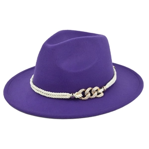 Detail view of purple fedora hat with white woven rope and gold rhinestone buckle trim