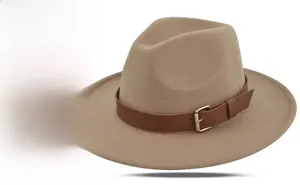Detailed view of the camel felt fedora hat featuring a brown leather band and gold buckle