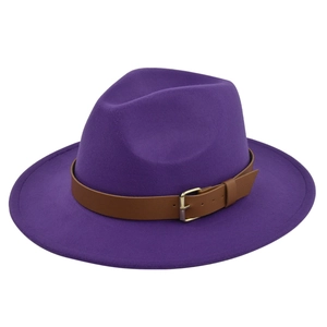 Detail of purple wool fedora hat featuring a brown leather band and gold metal buckle