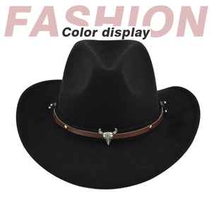 Detail of black felt cowboy hat featuring leather band with bull skull and gold studs