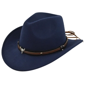 Detail of navy blue felt cowboy hat featuring leather band and silver bull skull ornament
