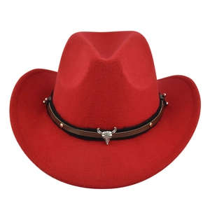 Detail of red wool cowboy hat featuring a silver bull skull ornament and metal rivets