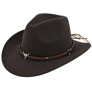 Close-up of brown wool felt cowboy hat featuring leather band with metal bull skull ornament