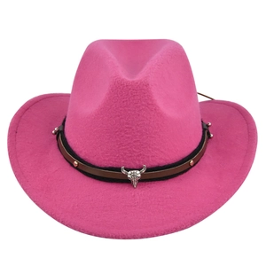 Detailed view of pink wool cowboy hat with silver bull head charm and studs decoration