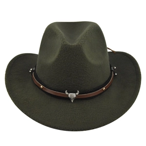 Detail of olive green fedora featuring a silver bull head metal emblem and woven band
